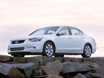 The 2010 Honda Accord Sedan may look dowdy next to the stylish coupe, but it $20 less each month it`s a pretty good bargain.